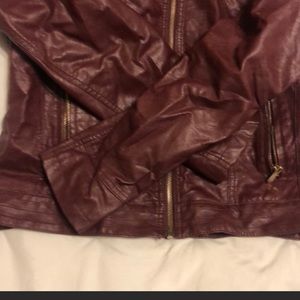 Beautiful Faux leather hooded jacket. Fits more like a Large. (Runs small)